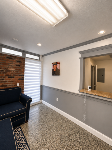 Secondary common area with couch and open pass-through
